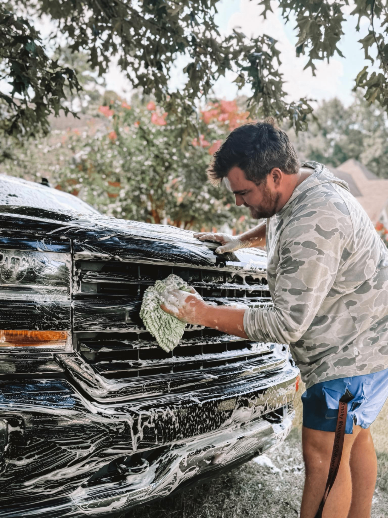 Ken hand washing a truck during a mobile detailing service